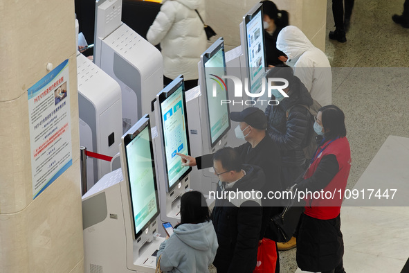 Patients are making appointments, paying fees, and collecting medicine at a hospital in Shanghai, China, on January 16, 2024. 