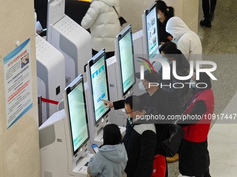 Patients are making appointments, paying fees, and collecting medicine at a hospital in Shanghai, China, on January 16, 2024. (