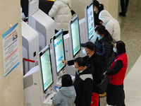 Patients are making appointments, paying fees, and collecting medicine at a hospital in Shanghai, China, on January 16, 2024. (