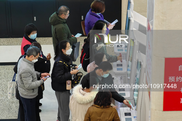 Patients are making appointments, paying fees, and collecting medicine at a hospital in Shanghai, China, on January 16, 2024. 