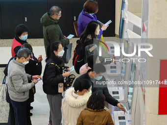 Patients are making appointments, paying fees, and collecting medicine at a hospital in Shanghai, China, on January 16, 2024. (