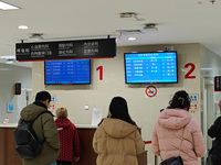 Patients are making appointments, paying fees, and collecting medicine at a hospital in Shanghai, China, on January 16, 2024. (