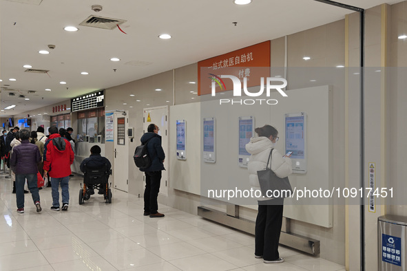 Patients are making appointments, paying fees, and collecting medicine at a hospital in Shanghai, China, on January 16, 2024. 