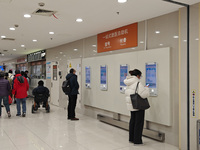 Patients are making appointments, paying fees, and collecting medicine at a hospital in Shanghai, China, on January 16, 2024. (