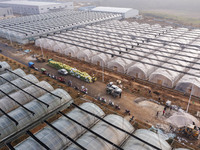 Workers are working at the construction site of a greenhouse for passion fruit cultivation in Congjiang County, Southwest China's Guizhou Pr...