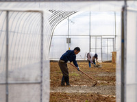 Workers are working at the construction site of a greenhouse for passion fruit cultivation in Congjiang County, Southwest China's Guizhou Pr...