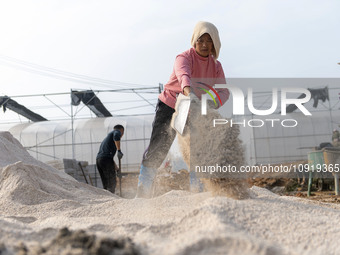 Workers are working at the construction site of a greenhouse for passion fruit cultivation in Congjiang County, Southwest China's Guizhou Pr...