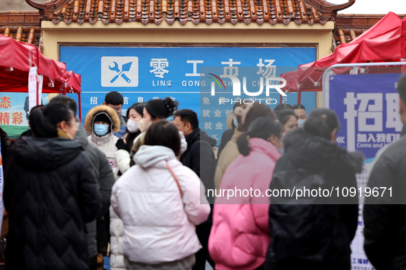 Job seekers are looking for suitable jobs at the 2024 job fair in Zaozhuang, East China's Shandong province, on January 17, 2024. 