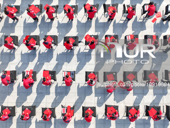 Teachers and students are writing the Chinese New Year couplet ''Fu'' at Shangbai Primary School in Deqing County, Huzhou, China, on January...