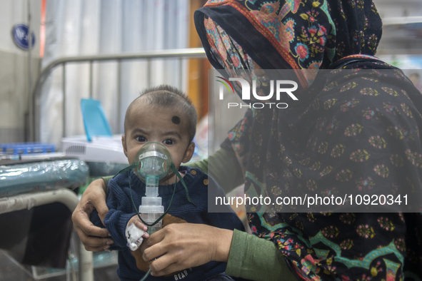 A child is receiving medical treatment for pneumonia at Dhaka Shishu Hospital in Dhaka, Bangladesh, on January 17, 2024. 