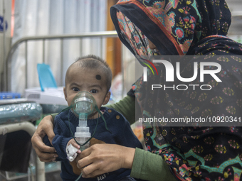 A child is receiving medical treatment for pneumonia at Dhaka Shishu Hospital in Dhaka, Bangladesh, on January 17, 2024. (