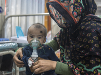 A child is receiving medical treatment for pneumonia at Dhaka Shishu Hospital in Dhaka, Bangladesh, on January 17, 2024. (