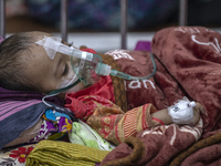 A child is receiving medical treatment for pneumonia at Dhaka Shishu Hospital in Dhaka, Bangladesh, on January 17, 2024. (