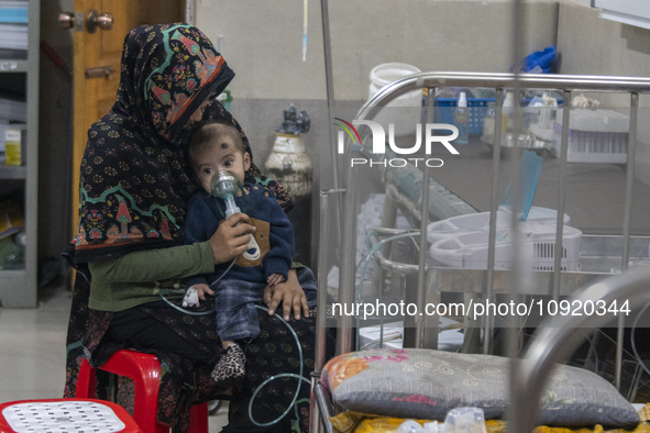 A child is receiving medical treatment for pneumonia at Dhaka Shishu Hospital in Dhaka, Bangladesh, on January 17, 2024. 