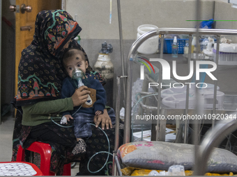 A child is receiving medical treatment for pneumonia at Dhaka Shishu Hospital in Dhaka, Bangladesh, on January 17, 2024. (