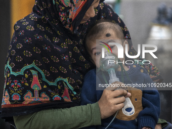 A child is receiving medical treatment for pneumonia at Dhaka Shishu Hospital in Dhaka, Bangladesh, on January 17, 2024. (