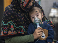 A child is receiving medical treatment for pneumonia at Dhaka Shishu Hospital in Dhaka, Bangladesh, on January 17, 2024. (