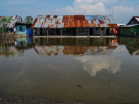 The Sicanang leprosy settlement in Medan, North Sumatra Province, Indonesia, is being impacted by tidal floods on July 3, 2012. The World He...