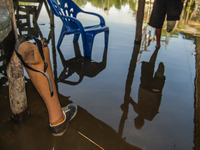 A prosthetic leg is lying beside a pillar in the Sicanang settlement, which is experiencing tidal flooding in Medan, North Sumatra Province,...