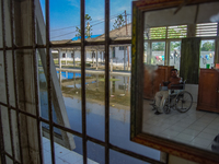 A person with leprosy is sitting in a wheelchair inside the Sicanang Special Hospital for leprosy sufferers in Medan, North Sumatra Province...