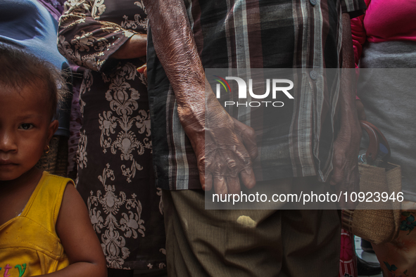 A child is seen within the leper community mass, which is protesting against the stigma and neglect at the North Sumatra Governor's office i...