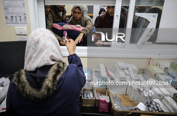 A UNRWA employee is providing a Polio vaccine in a clinic in Deir al-Balah, central Gaza Strip, on January 21, 2024, amid ongoing battles be...