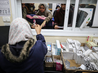 A UNRWA employee is providing a Polio vaccine in a clinic in Deir al-Balah, central Gaza Strip, on January 21, 2024, amid ongoing battles be...