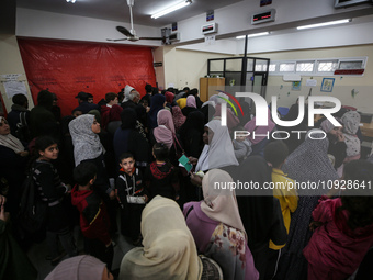 A UNRWA employee is providing a Polio vaccine in a clinic in Deir al-Balah, central Gaza Strip, on January 21, 2024, amid ongoing battles be...