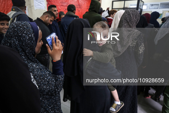 A UNRWA employee is providing a Polio vaccine in a clinic in Deir al-Balah, central Gaza Strip, on January 21, 2024, amid ongoing battles be...