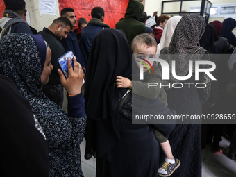 A UNRWA employee is providing a Polio vaccine in a clinic in Deir al-Balah, central Gaza Strip, on January 21, 2024, amid ongoing battles be...