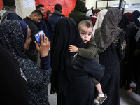 A UNRWA employee is providing a Polio vaccine in a clinic in Deir al-Balah, central Gaza Strip, on January 21, 2024, amid ongoing battles be...