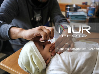 A UNRWA employee is providing a Polio vaccine in a clinic in Deir al-Balah, central Gaza Strip, on January 21, 2024, amid ongoing battles be...