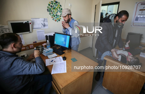 A UNRWA employee is providing a Polio vaccine in a clinic in Deir al-Balah, central Gaza Strip, on January 21, 2024, amid ongoing battles be...