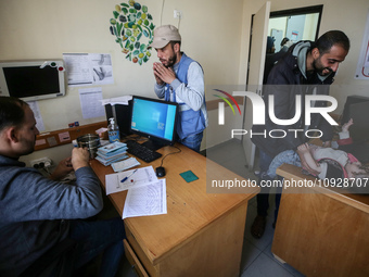 A UNRWA employee is providing a Polio vaccine in a clinic in Deir al-Balah, central Gaza Strip, on January 21, 2024, amid ongoing battles be...