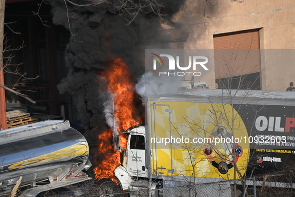 A box truck is catching fire at a warehouse on Marshall Street in Paterson, New Jersey, United States, on January 22, 2024. Authorities are...