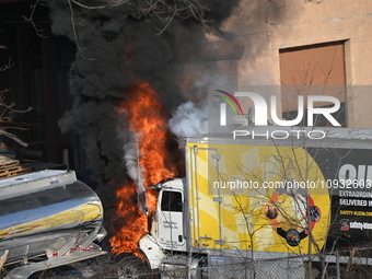 A box truck is catching fire at a warehouse on Marshall Street in Paterson, New Jersey, United States, on January 22, 2024. Authorities are...