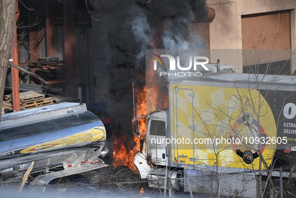 A box truck is catching fire at a warehouse on Marshall Street in Paterson, New Jersey, United States, on January 22, 2024. Authorities are...