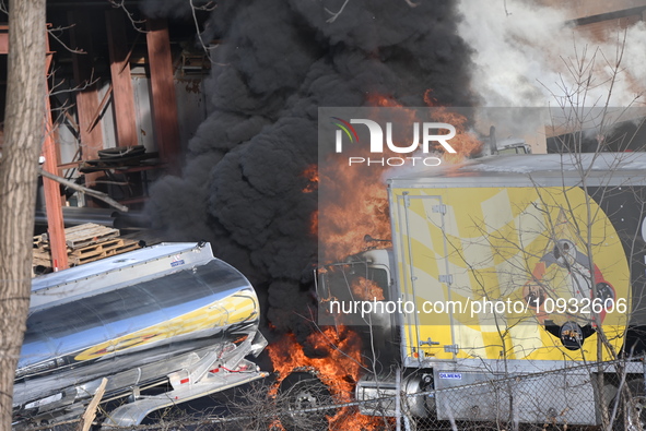 A box truck is catching fire at a warehouse on Marshall Street in Paterson, New Jersey, United States, on January 22, 2024. Authorities are...