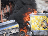 A box truck is catching fire at a warehouse on Marshall Street in Paterson, New Jersey, United States, on January 22, 2024. Authorities are...