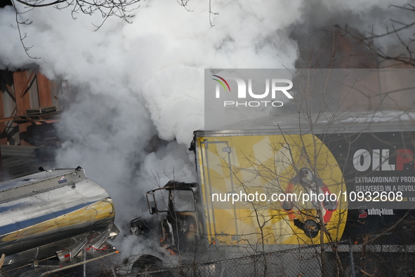 A box truck is catching fire at a warehouse on Marshall Street in Paterson, New Jersey, United States, on January 22, 2024. Authorities are...