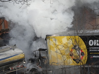 A box truck is catching fire at a warehouse on Marshall Street in Paterson, New Jersey, United States, on January 22, 2024. Authorities are...