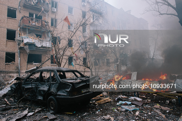 Cars are burning next to the site where the rocket struck, in Kharkiv, Ukraine, on January 23, 2024. On The Morning Of January 23, 2024, Rus...