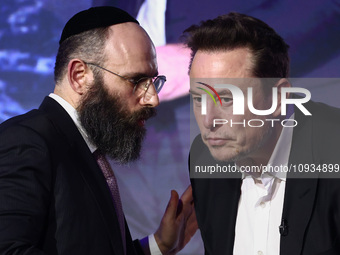 Elon Musk, owner of Tesla and the X (formerly Twitter) platform and EJA Chairman Rabbi Menachem Margolin attend a symposium on fighting anti...