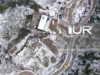 Workers are inspecting power supply lines in the cold mountainous area of Dongling village in Liuzhou, China, on January 23, 2024. (