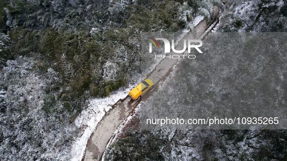 Workers are inspecting power supply lines in the cold mountainous area of Dongling village in Liuzhou, China, on January 23, 2024. 