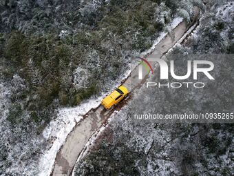 Workers are inspecting power supply lines in the cold mountainous area of Dongling village in Liuzhou, China, on January 23, 2024. (