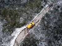 Workers are inspecting power supply lines in the cold mountainous area of Dongling village in Liuzhou, China, on January 23, 2024. (