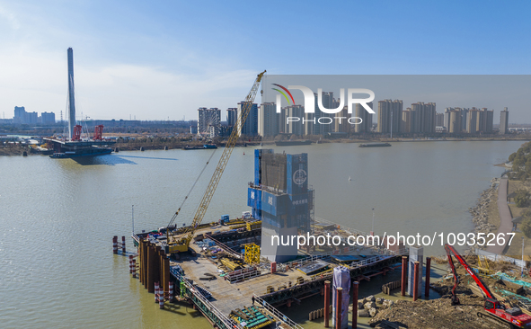 Workers are speeding up the construction of Taoyuan Bridge on the Beijing-Hangzhou Grand Canal in Suqian, East China's Jiangsu province, on...