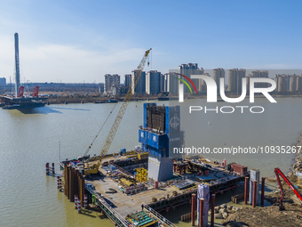 Workers are speeding up the construction of Taoyuan Bridge on the Beijing-Hangzhou Grand Canal in Suqian, East China's Jiangsu province, on...