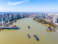 Workers are speeding up the construction of Taoyuan Bridge on the Beijing-Hangzhou Grand Canal in Suqian, East China's Jiangsu province, on...